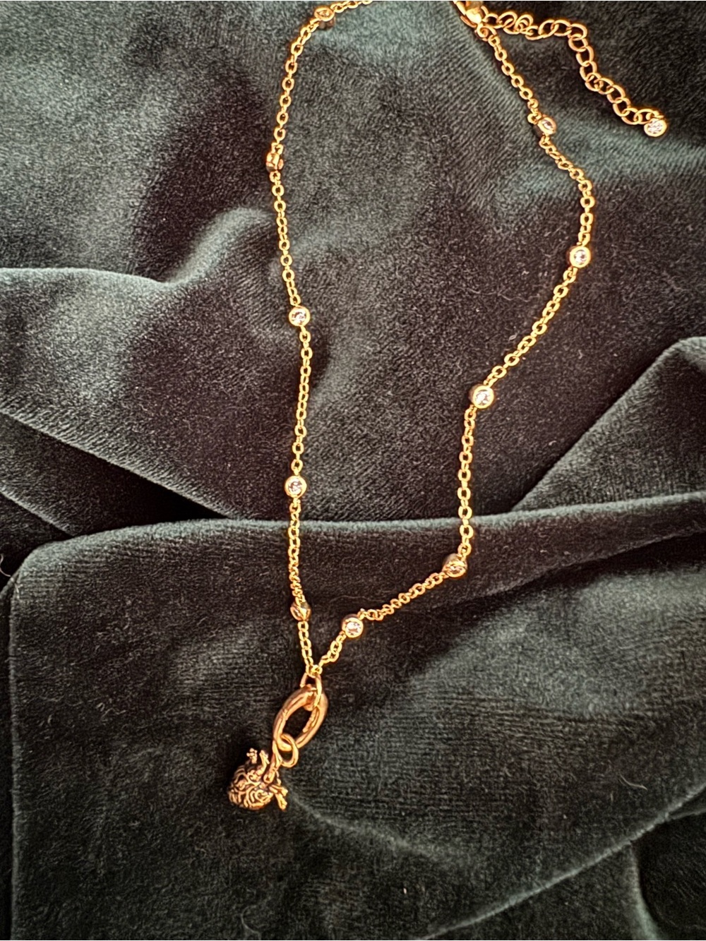 Gold Tone Crystal Station Necklace with Charm